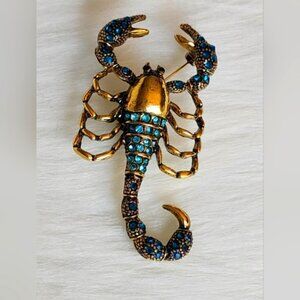 Stunning Scorpion Brooch Bejeweled with Blue Gemstones